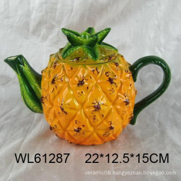 Handpainting ceramic teapots in pineapple pattern